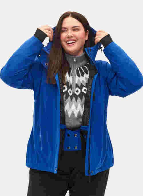 Ski jas met verstelbare onderkant en capuchon