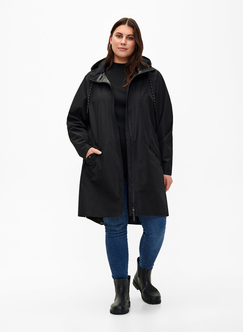 Regenjas met zakken en capuchon, Zwart, Model image number 1