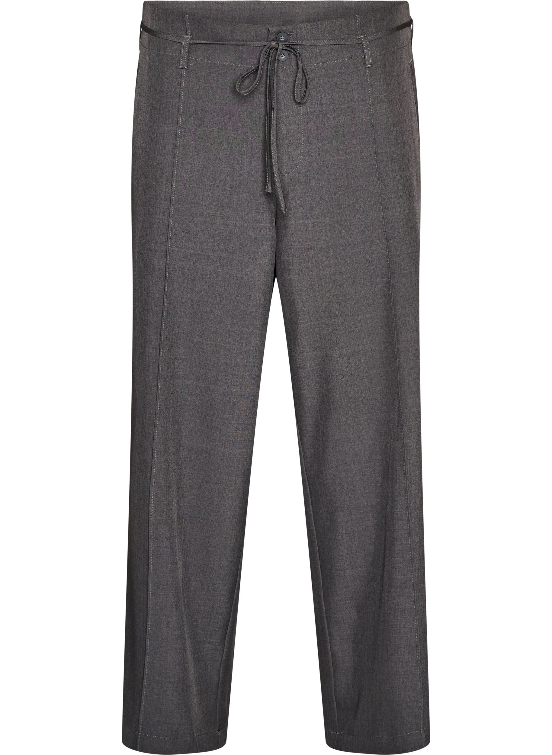 Op maat gemaakte broek met plooien en een strikceintuur