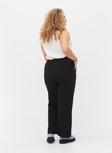 Flared broek met elastiek in de taille, Black, Model image number 1