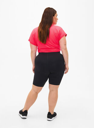 Nauwsluitende training shorts met zak, Black, Model image number 1