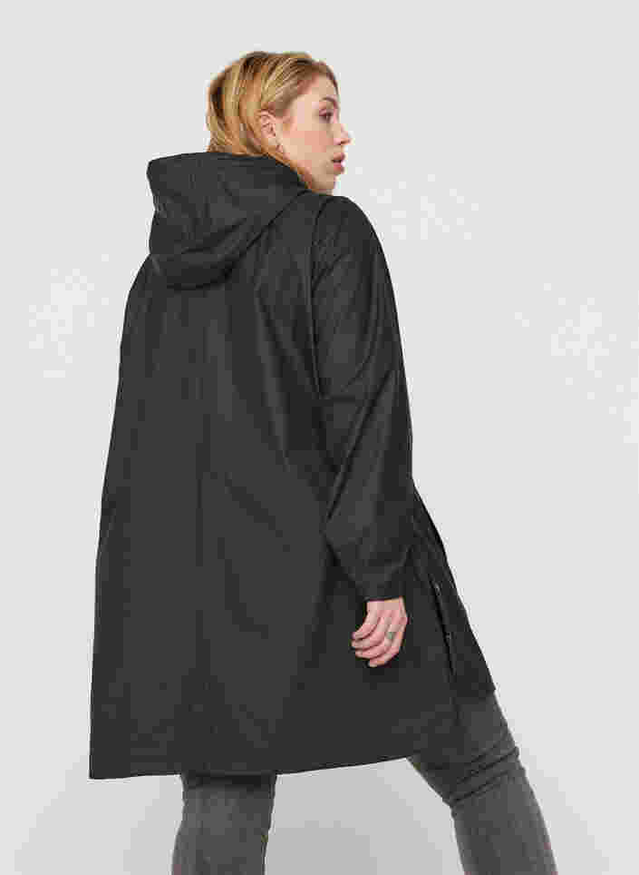 Regenjas met capuchon en zakken, Black, Model image number 1
