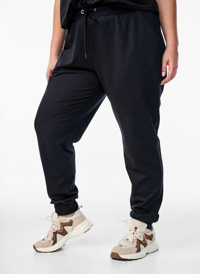 Losse trainingsbroek met zakken, Zwart, Model image number 0