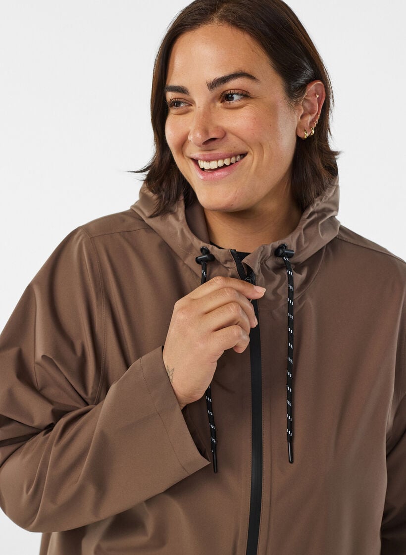 Regenjas met zakken en capuchon, Bruin, Model image number 3