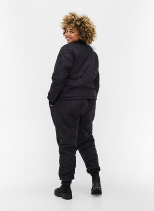 Gewatteerde 2-in-1 jumpsuit met zakken, Black, Model image number 0