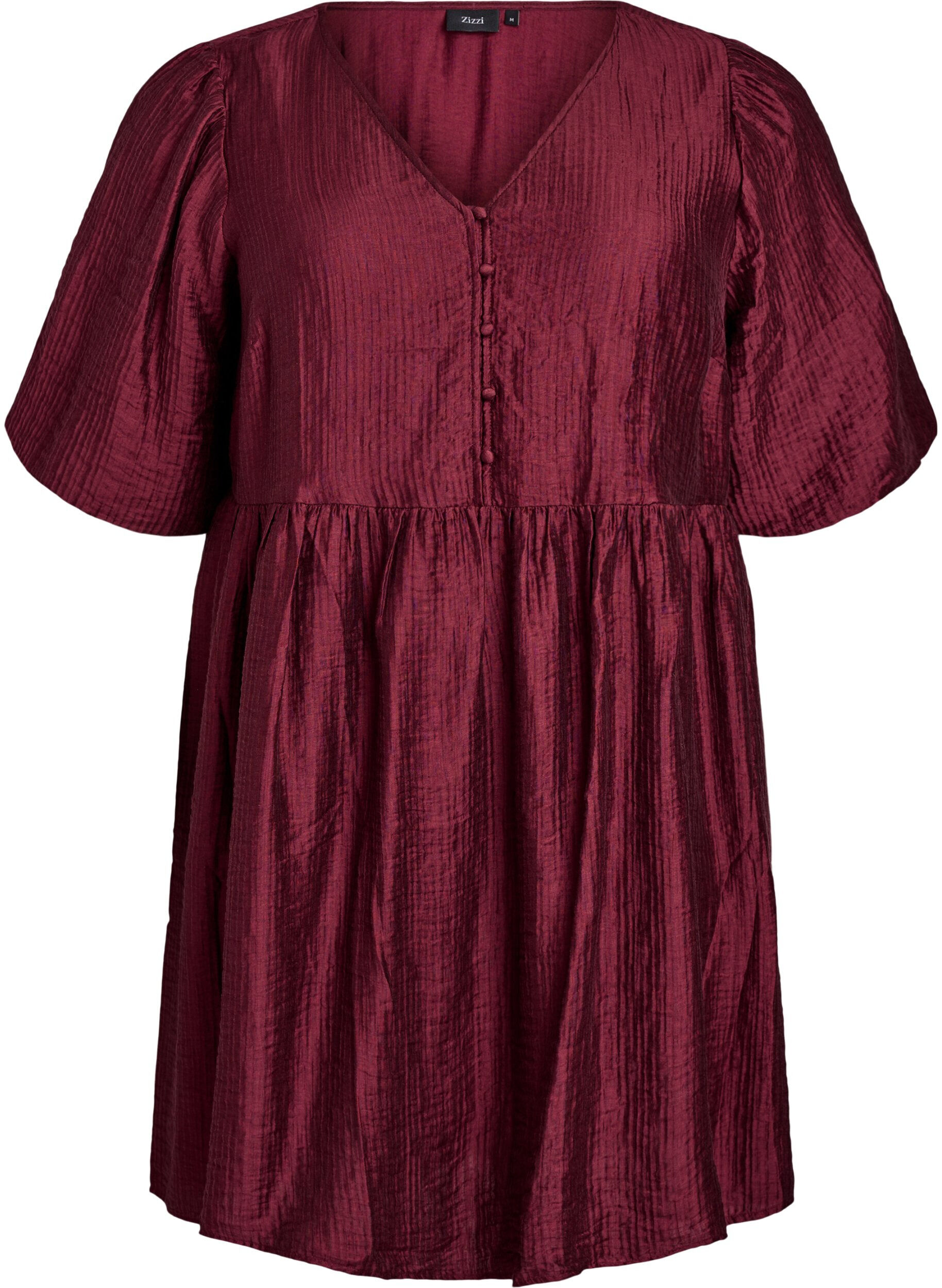 Korte jurk met textuur en korte ballonmouwen