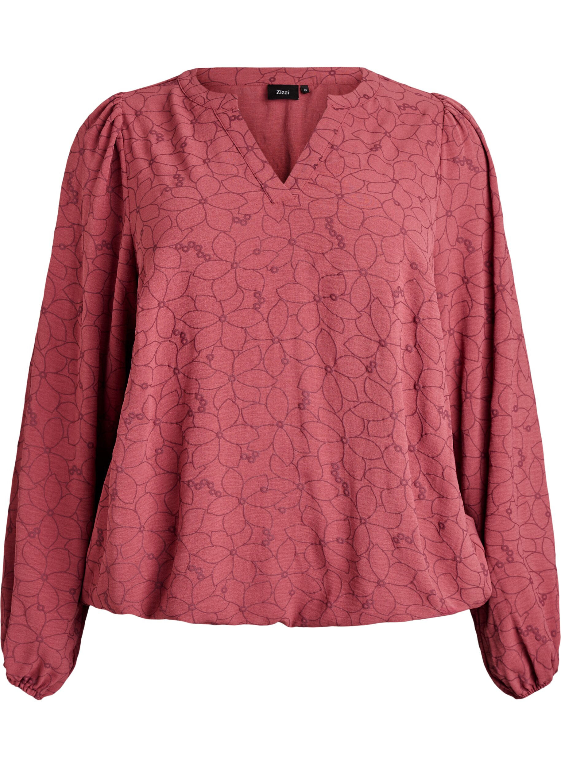 Blouse met lange mouwen met bloemenborduursel.