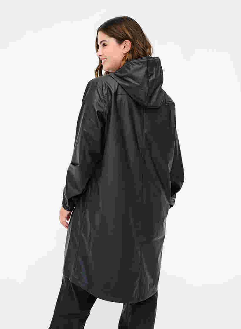 Regenjas met capuchon en knoopsluiting, Black, Model image number 1
