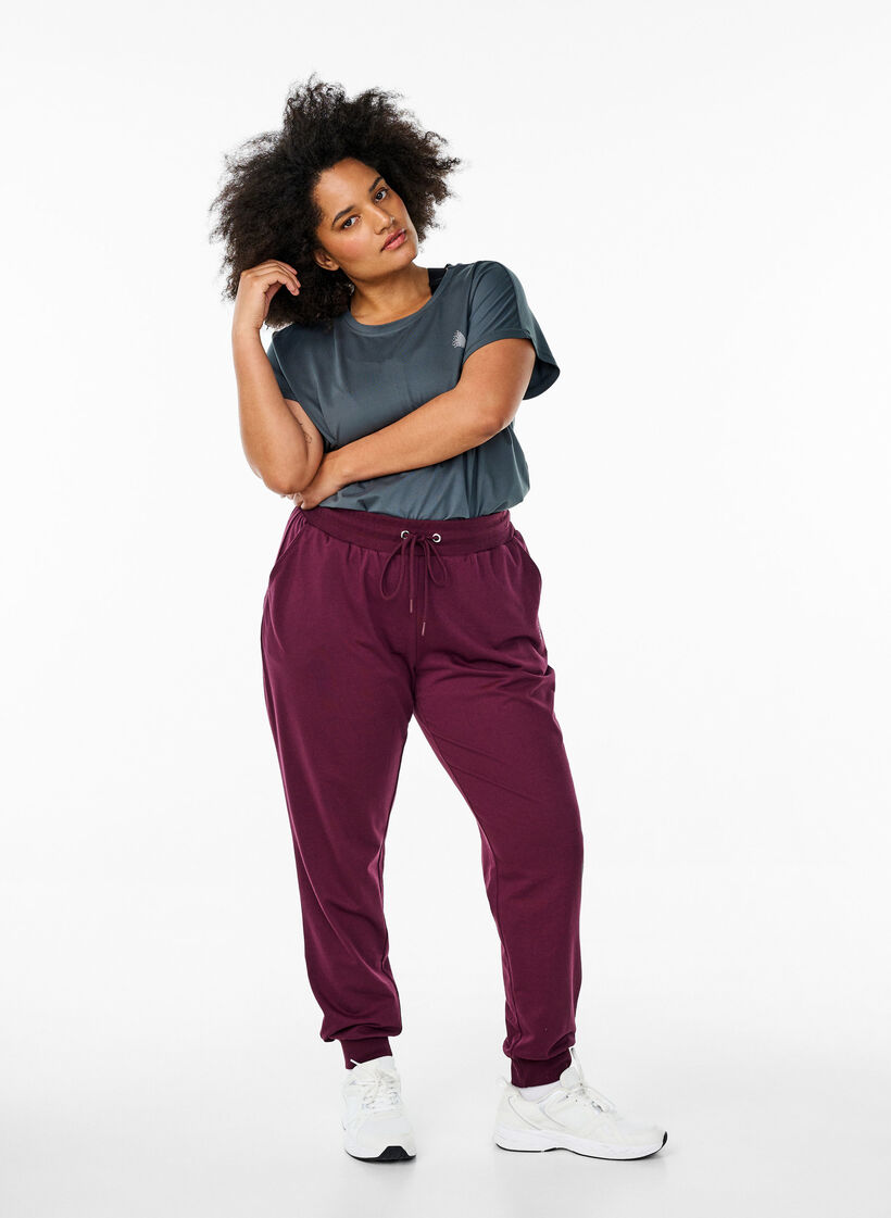 Losse trainingsbroek met zakken, Rood, Model image number 1