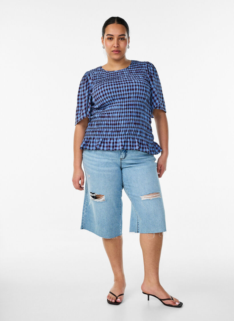 Gecropte jeans met een versleten look en rafelige randen, Blauw, Model